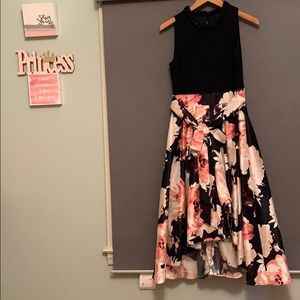 High low, high neck dress.